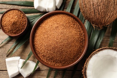 Flat lay composition with natural coconut sugar on wooden table