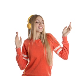 Photo of Beautiful young woman listening to music with headphones on white background