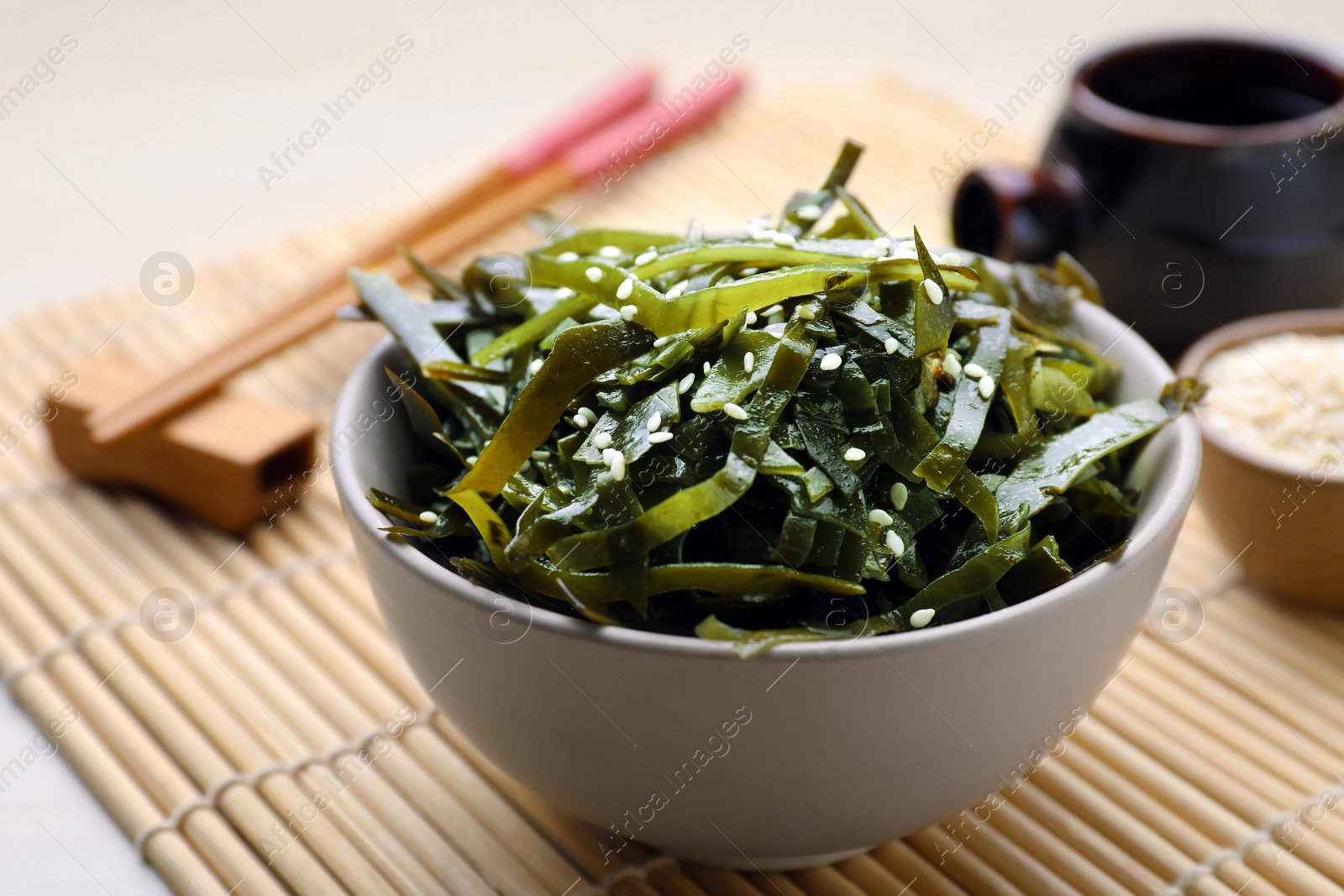 Photo of Fresh laminaria (kelp) seaweed served on table