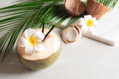 Photo of Beautiful composition with fresh green coconut on table