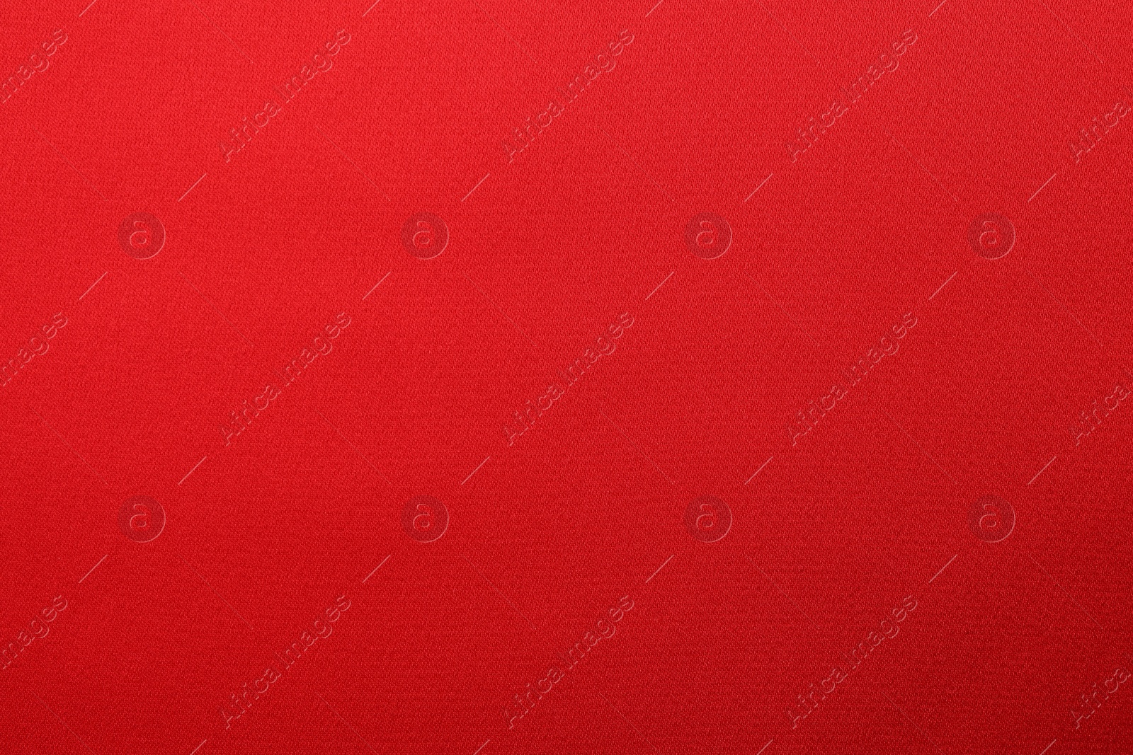 Photo of Texture of red silk fabric as background, top view