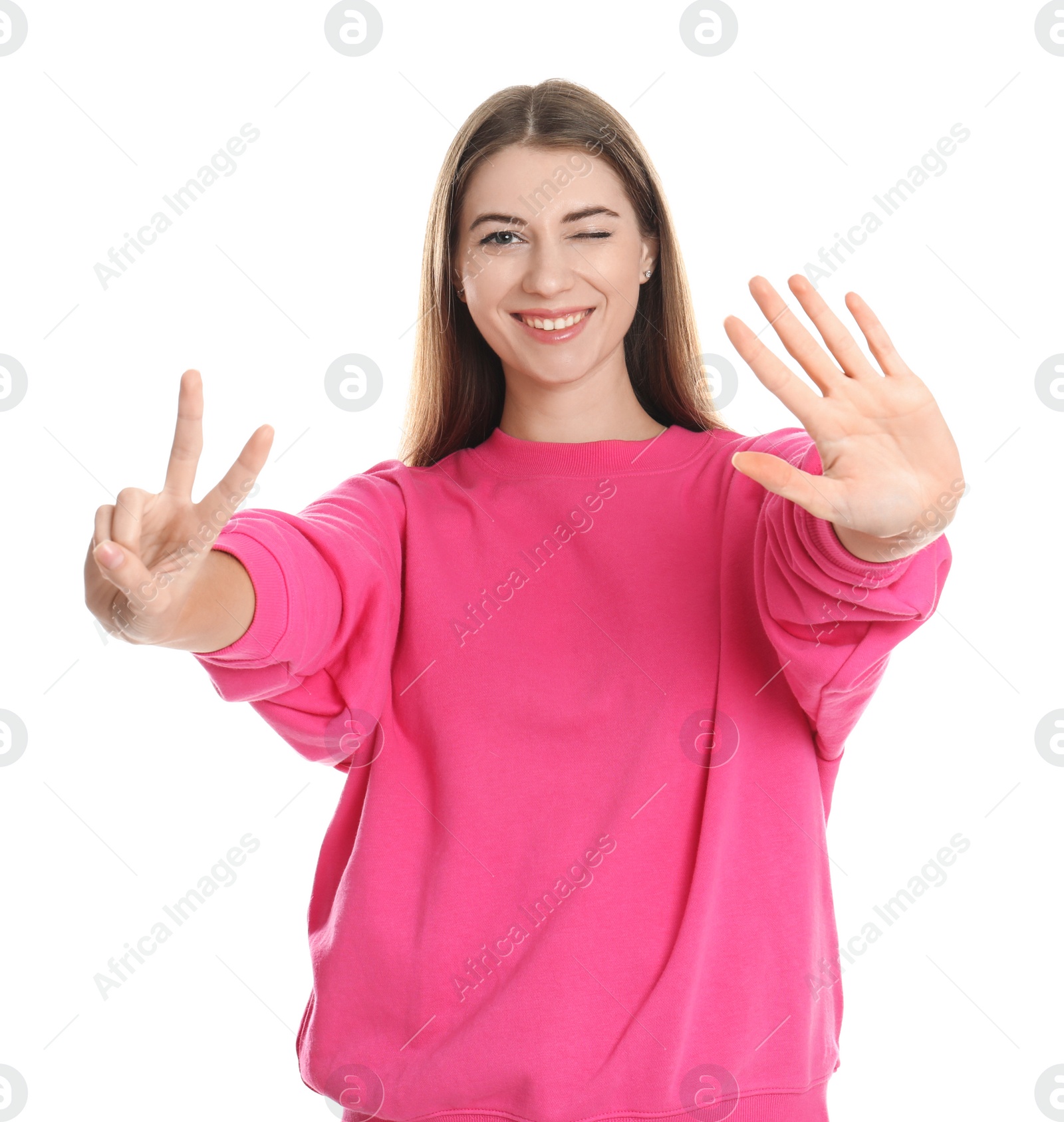 Photo of Woman showing number seven with her hands on white background