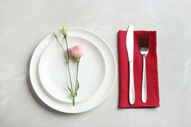 Photo of Elegant table setting on grey marble table, flat lay