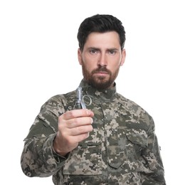 Soldier holding hand grenade on white background. Military service