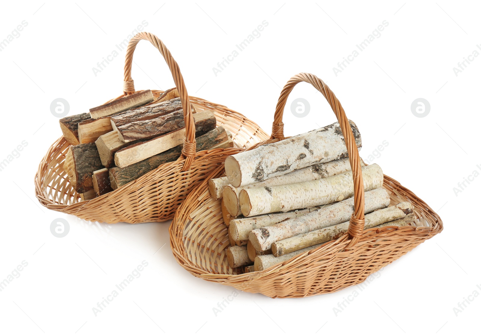 Photo of Wicker baskets with firewood on white background