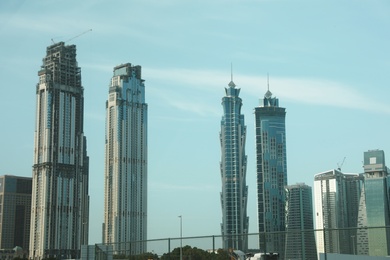 Photo of DUBAI, UNITED ARAB EMIRATES - NOVEMBER 03, 2018: Landscape with luxury hotels on sunny day