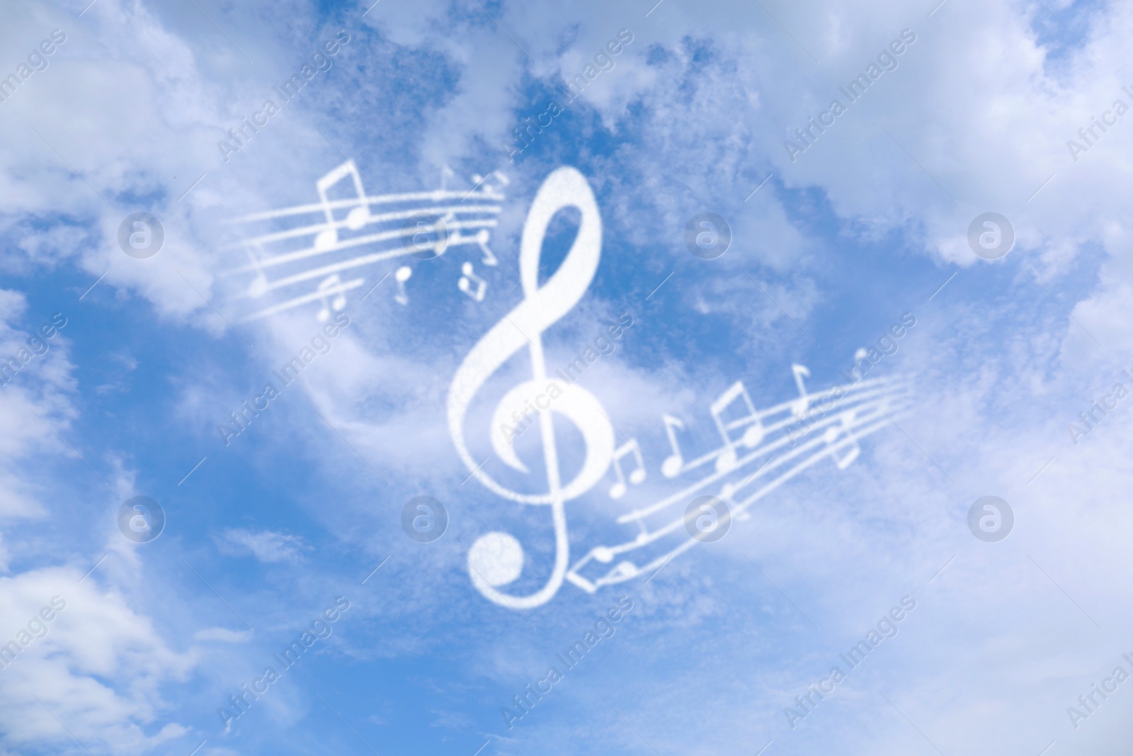 Image of Treble clef and musical notes against sky