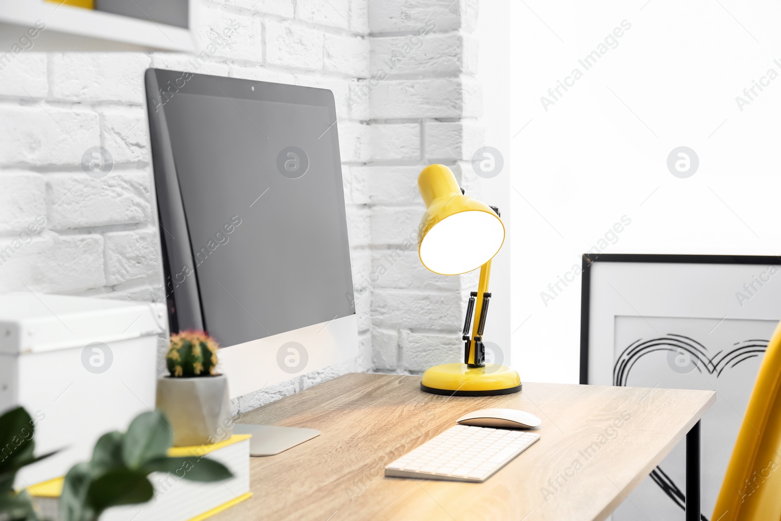 Photo of Comfortable workplace with computer on desk in home office