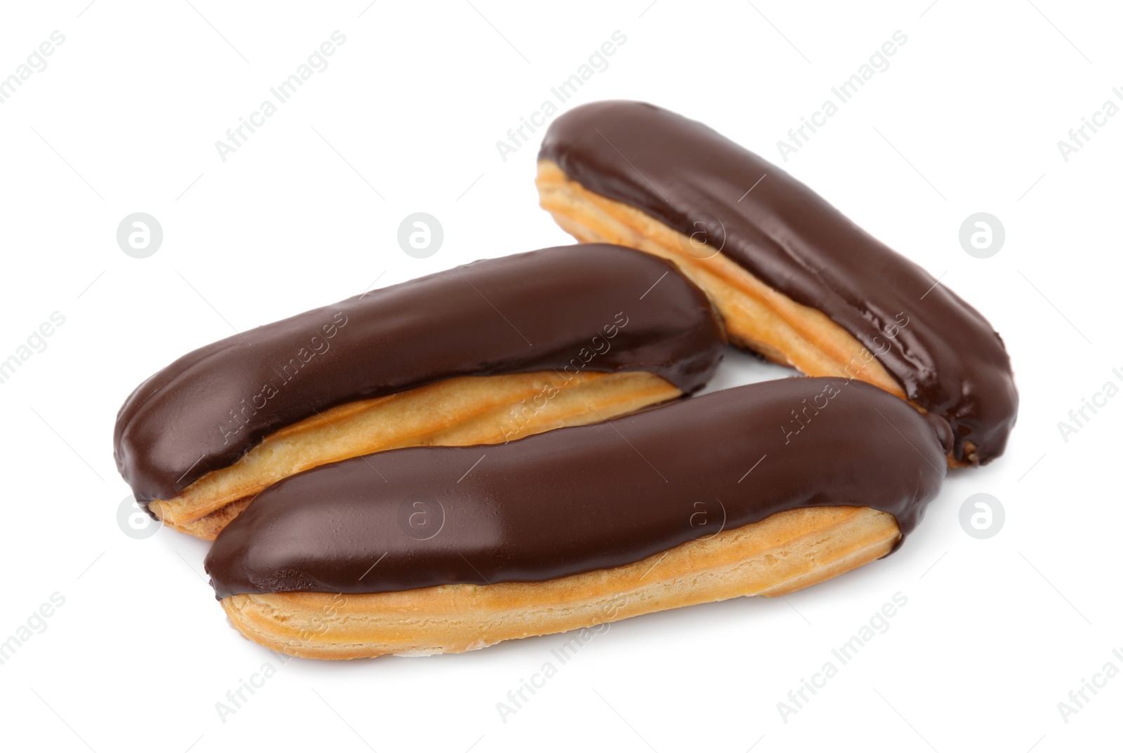 Photo of Delicious eclairs covered with chocolate isolated on white