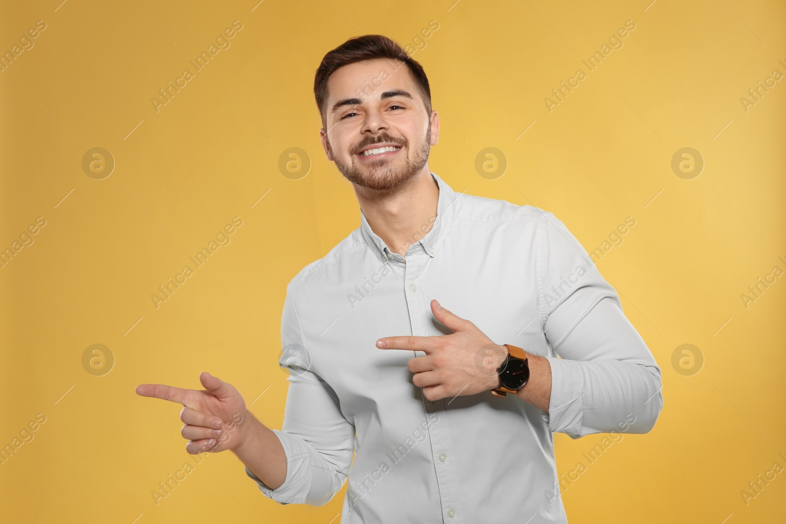 Photo of Portrait of handsome young man on color background