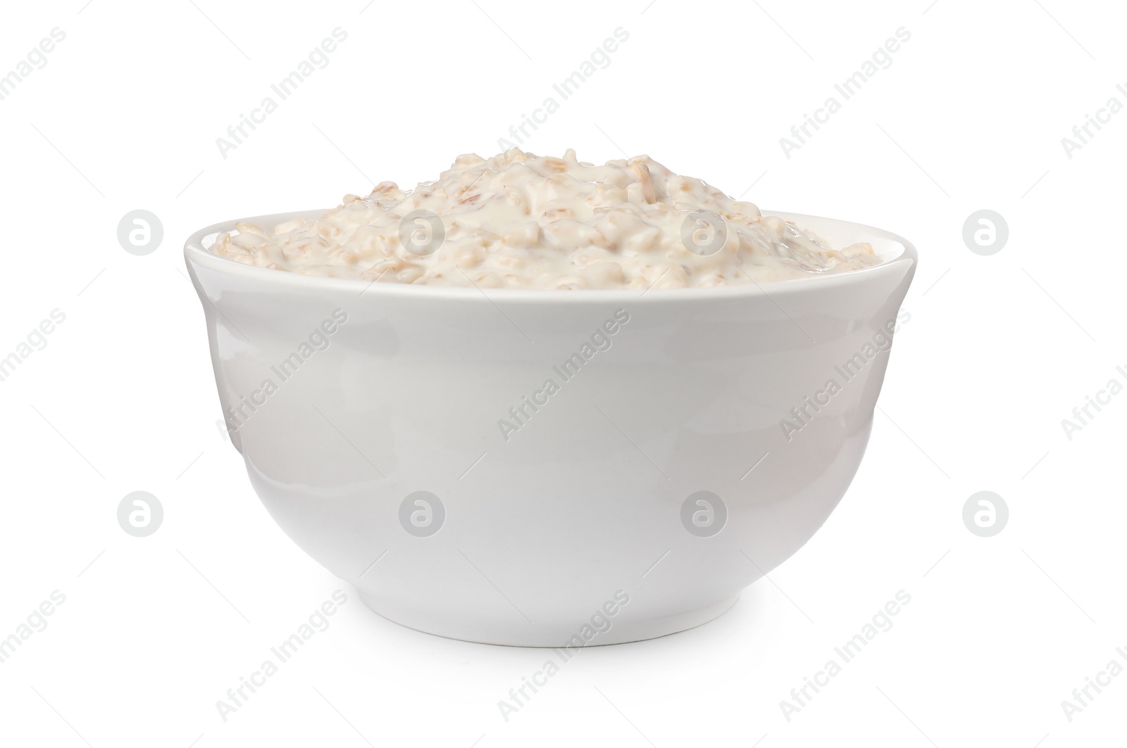 Photo of Tasty boiled oatmeal in bowl isolated on white