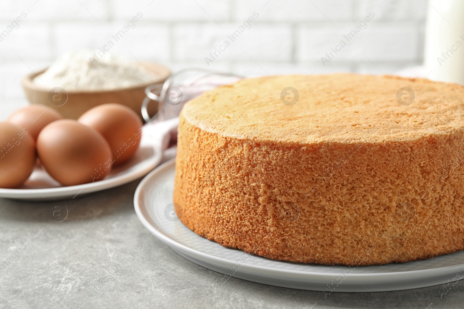 Photo of Delicious fresh homemade cake on light grey marble table