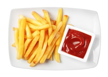 Photo of Tasty French fries and ketchup on white background, top view