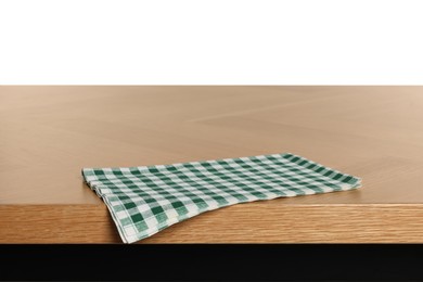 Photo of Checkered tablecloth on wooden table against white background