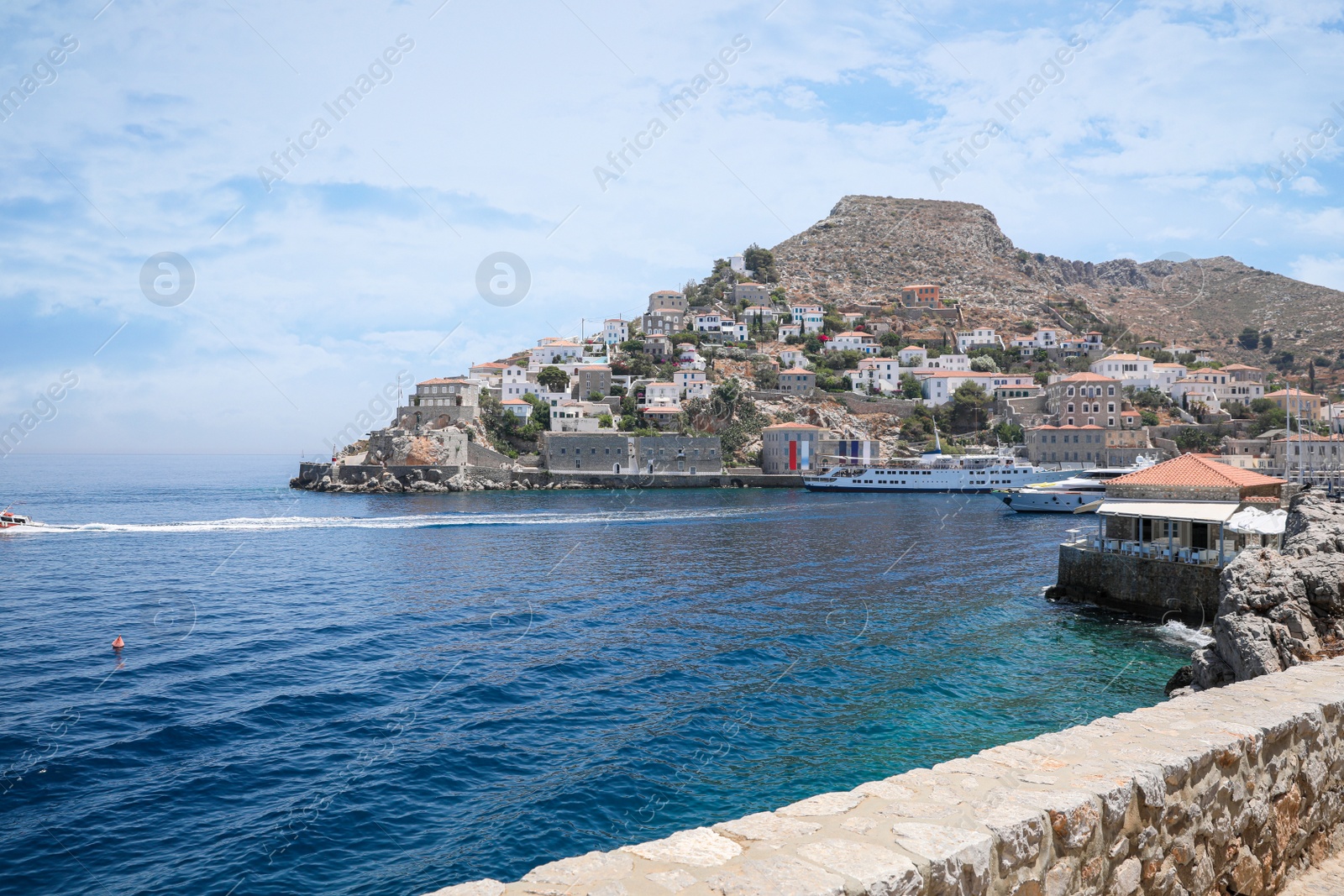 Photo of Beautiful view of sea with boats and coastal city