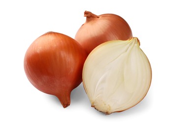 Whole and cut onions on white background