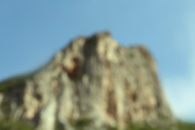 Blurred view of high mountains under sky outdoors