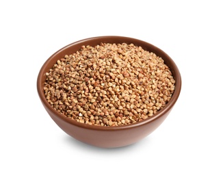 Bowl with uncooked buckwheat on white background