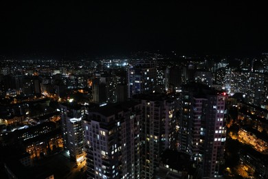 Photo of Picturesque view of city with buildings at night