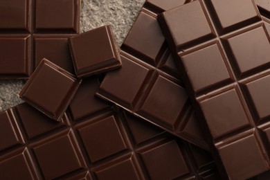 Delicious dark chocolate on grey table, closeup