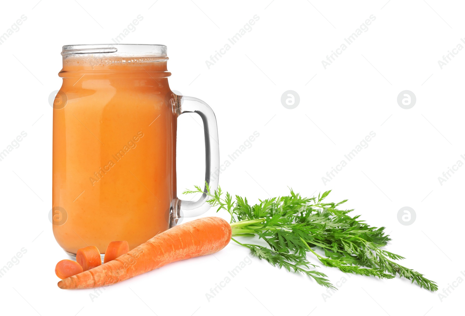 Image of Carrots and glass of fresh juice on white background
