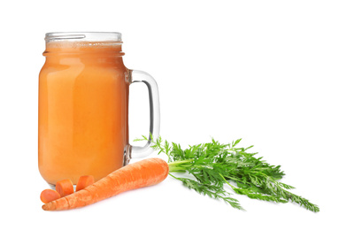 Carrots and glass of fresh juice on white background
