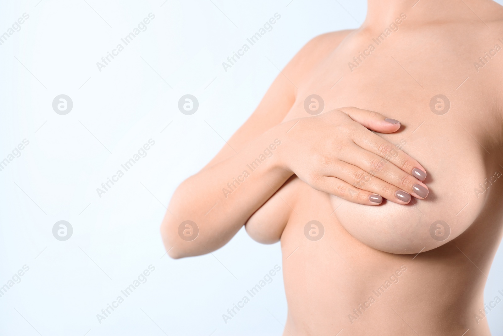 Photo of Woman covering her breast and space for text on white background, closeup. Self examination