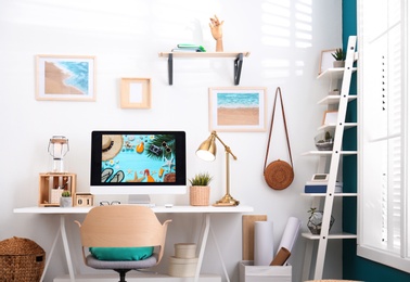 Photo of Home workplace with modern computer and desk in room