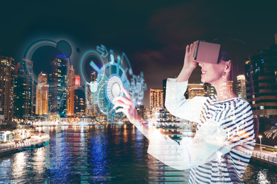 Image of Double exposure of woman using virtual reality headset and cityscape. Modern technology