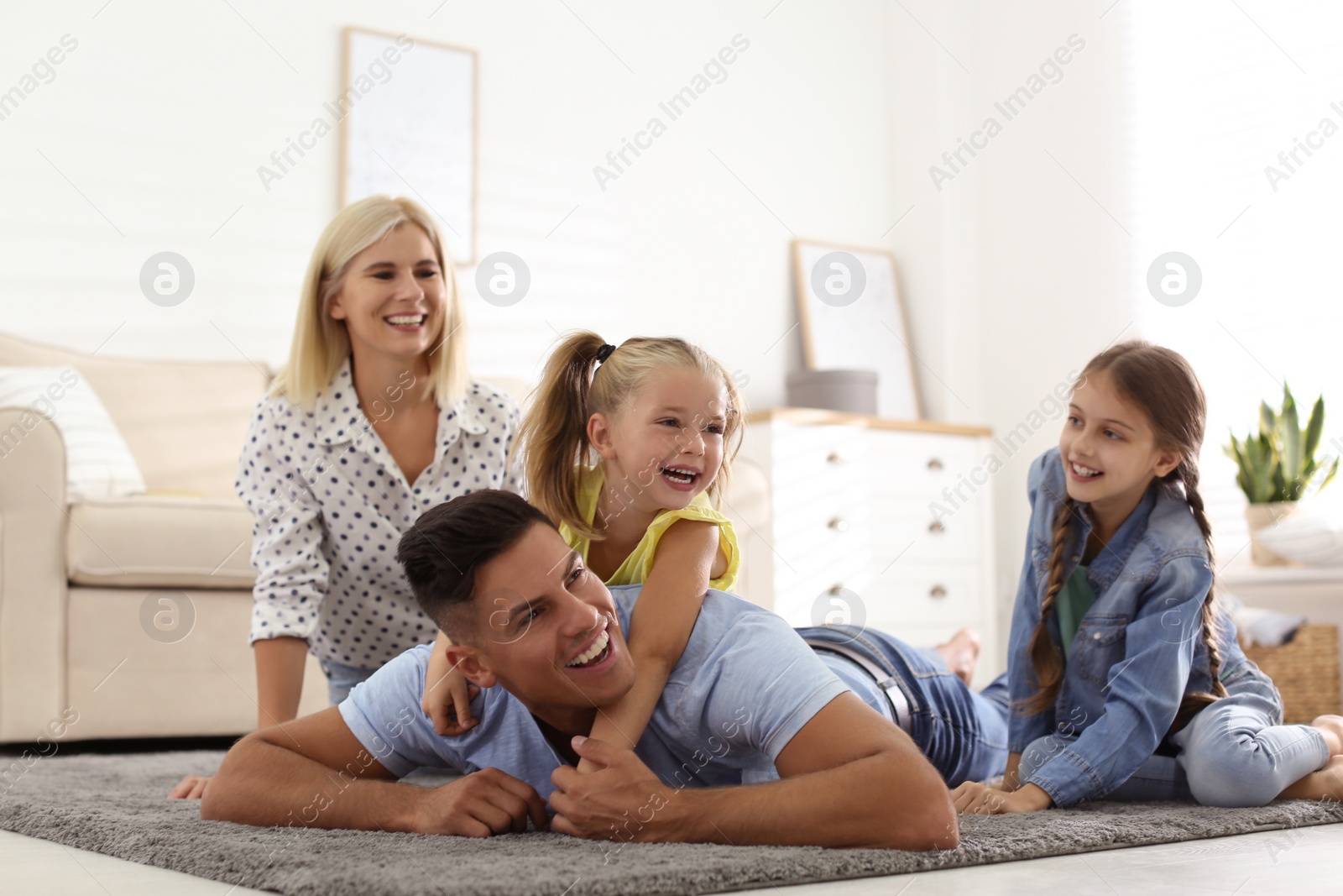 Photo of Happy family spending time together at home