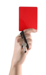 Referee holding red card and whistle on white background, closeup