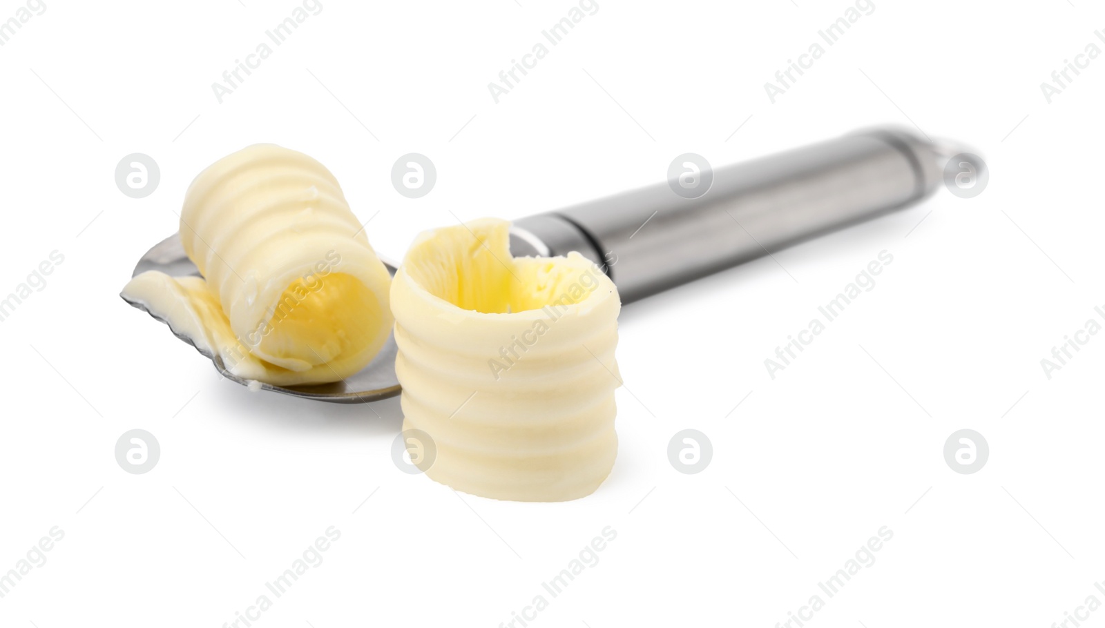 Photo of Butter curls and spoon isolated on white