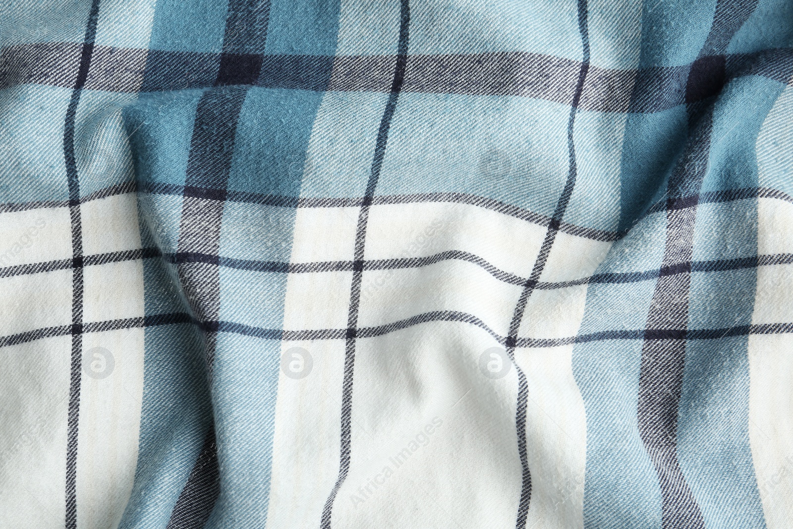 Photo of Texture of blue checkered fabric as background, closeup
