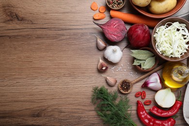 Photo of Fresh borscht ingredients on wooden table, flat lay. Space for text