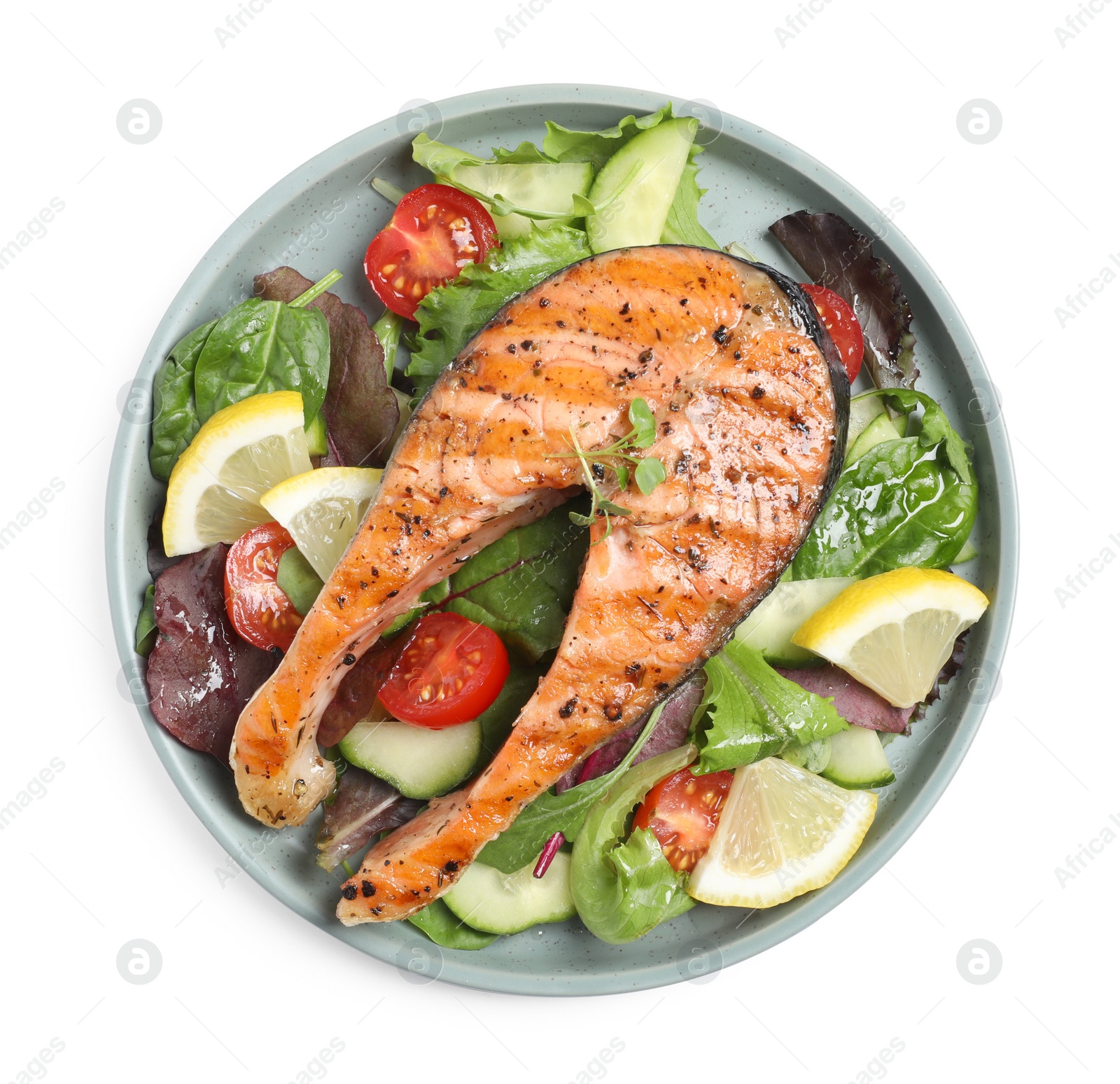 Photo of Tasty salmon steak with lemon and vegetables on white background, top view