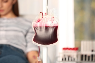 Blood donation pack hanging on dropper stand at hospital