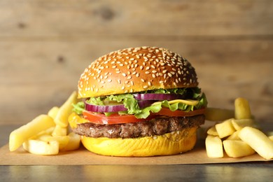 Photo of Burger with delicious patty and french fries on table, closeup