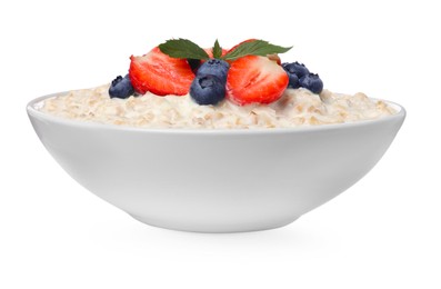 Photo of Tasty boiled oatmeal with berries in bowl isolated on white