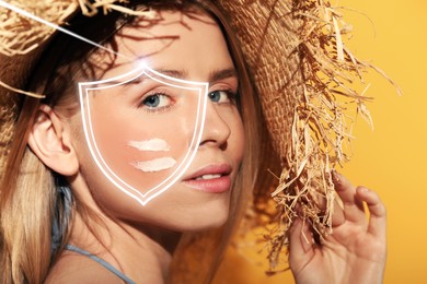 Image of Sun protection care. Beautiful woman with sunscreen on face against golden background. Illustration of shield as SPF
