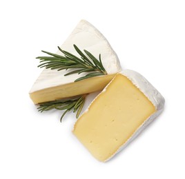 Photo of Pieces of tasty camembert cheese and rosemary isolated on white, above view