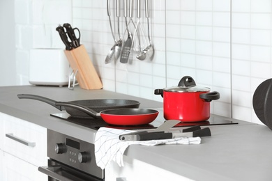 Different clean cookware and utensils in kitchen