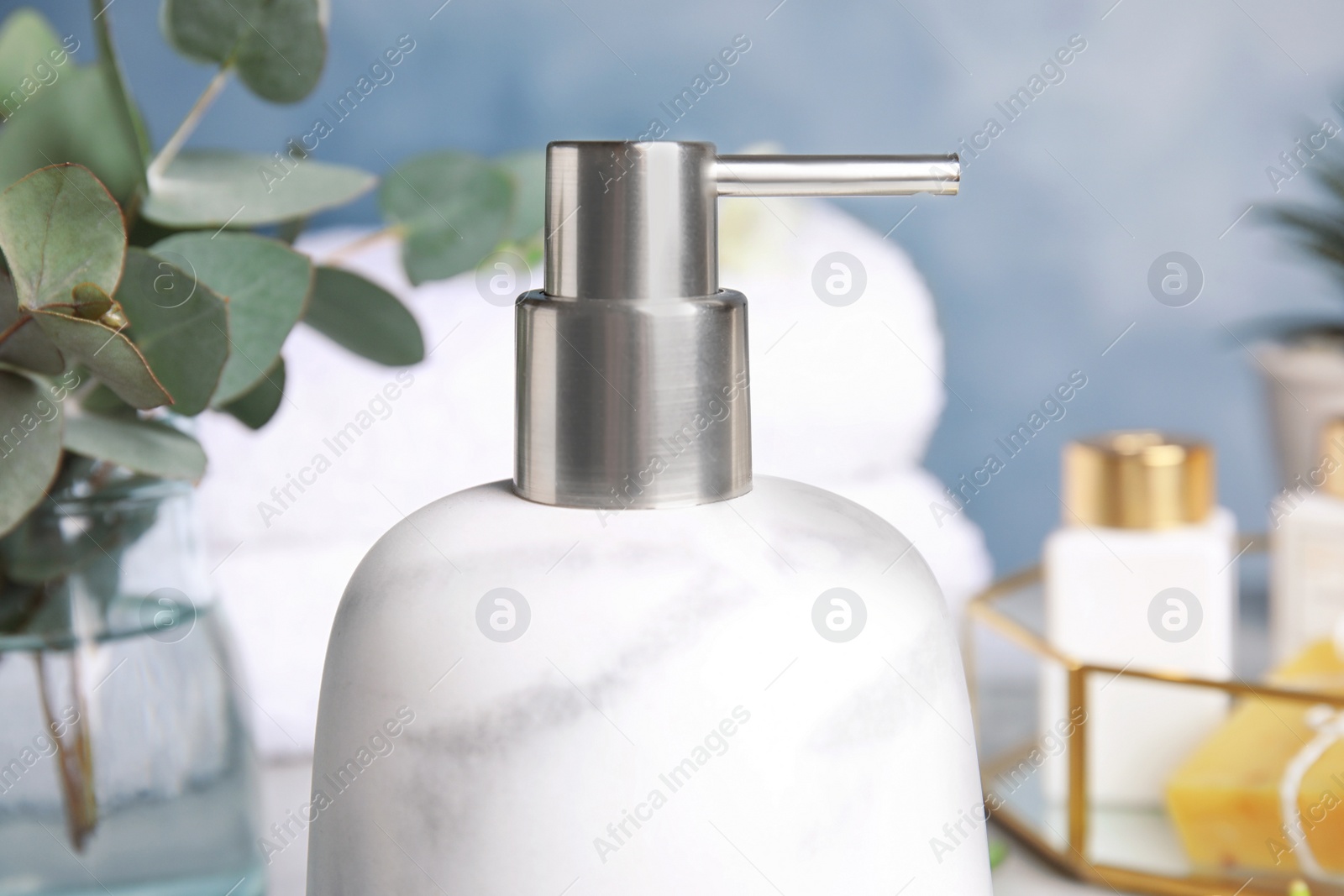 Photo of Modern marble soap dispenser in bathroom, closeup