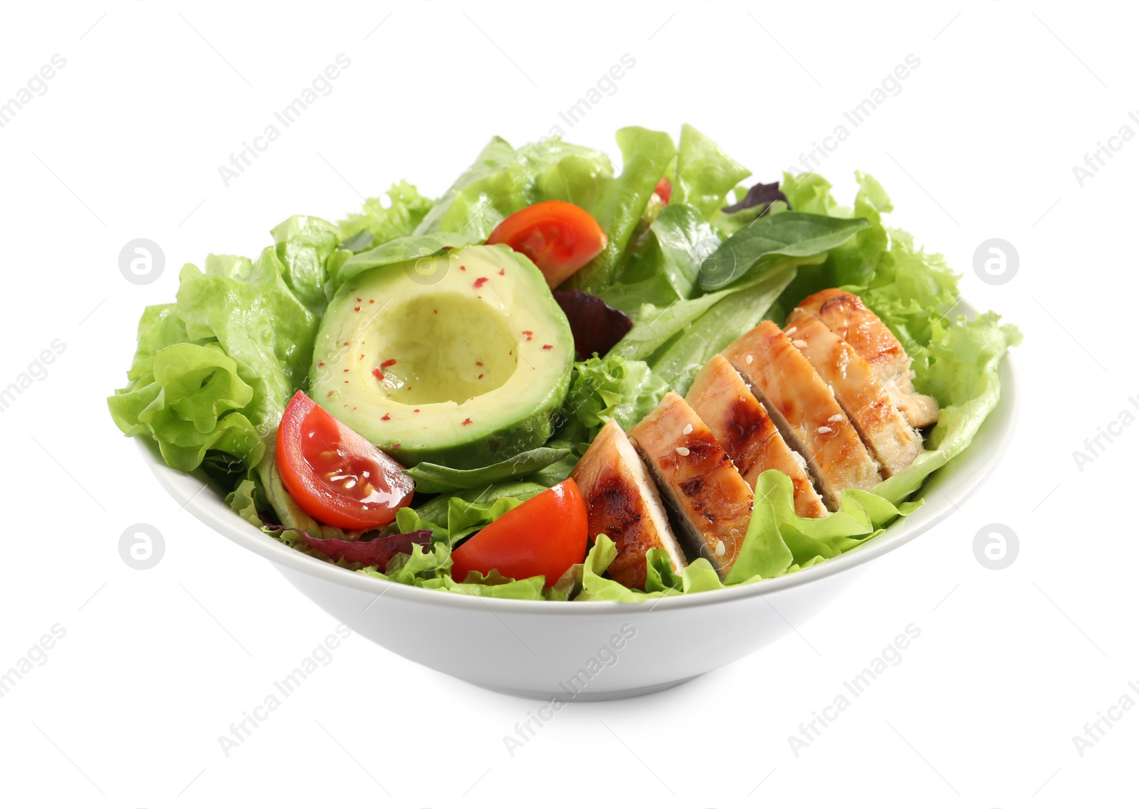 Photo of Delicious salad with chicken, cherry tomato and avocado in bowl isolated on white