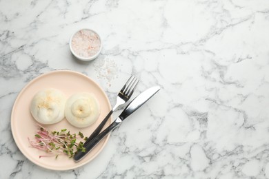 Photo of Delicious burrata cheese on white marble table, flat lay. Space for text