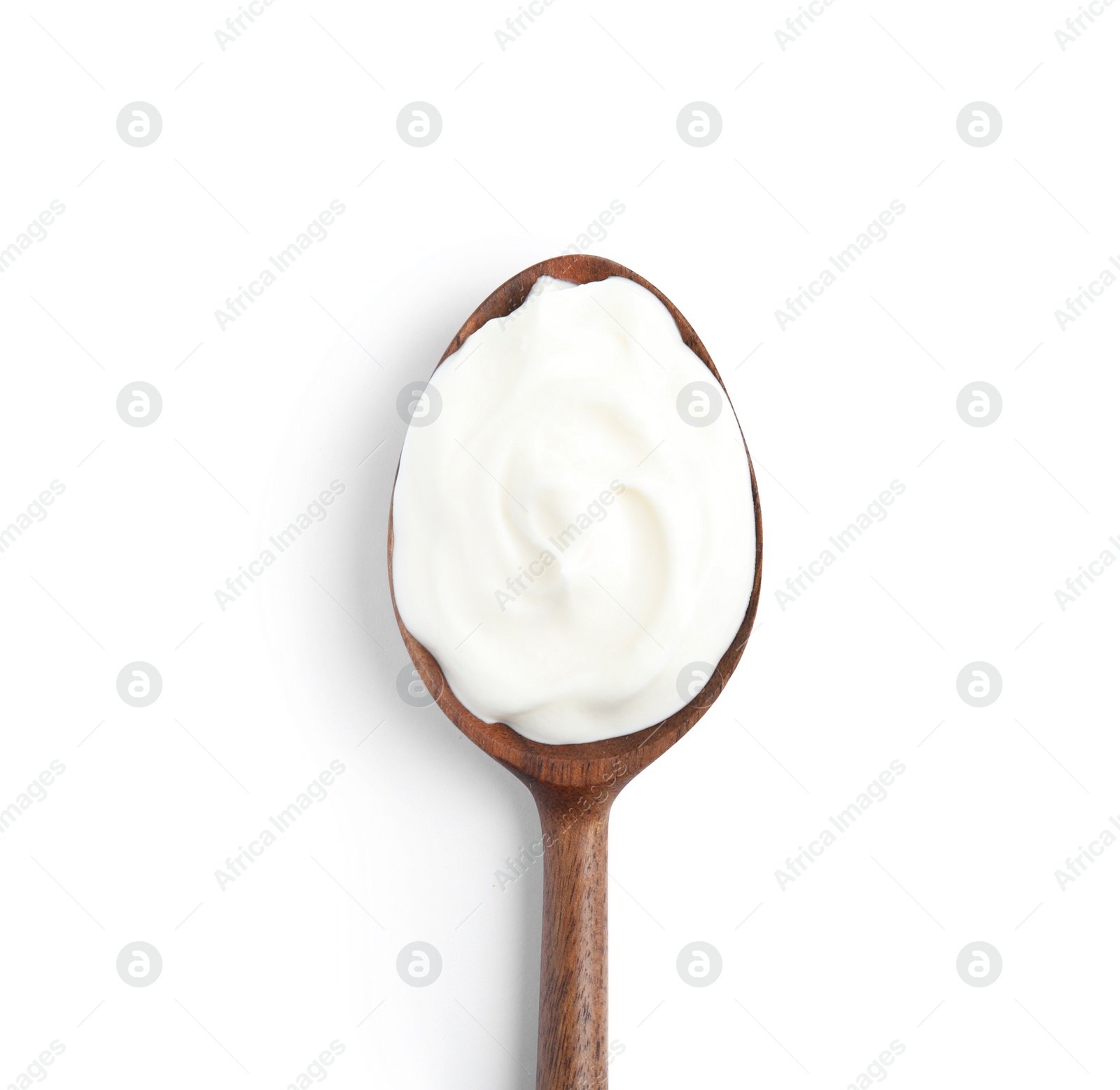 Photo of Wooden spoon with sour cream on white background, top view