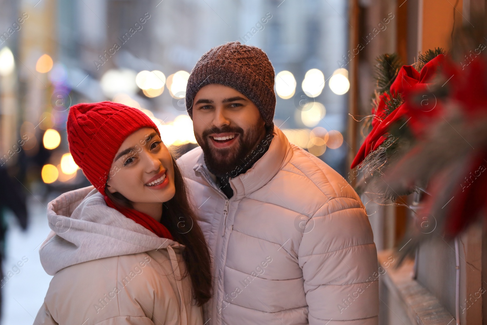 Photo of Lovely couple spending time together on city street