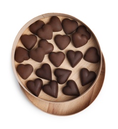 Photo of Tasty heart shaped chocolate candies on white background, top view. Happy Valentine's day