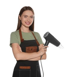 Photo of Portrait of happy hairdresser with hairdryer and round brush on white background