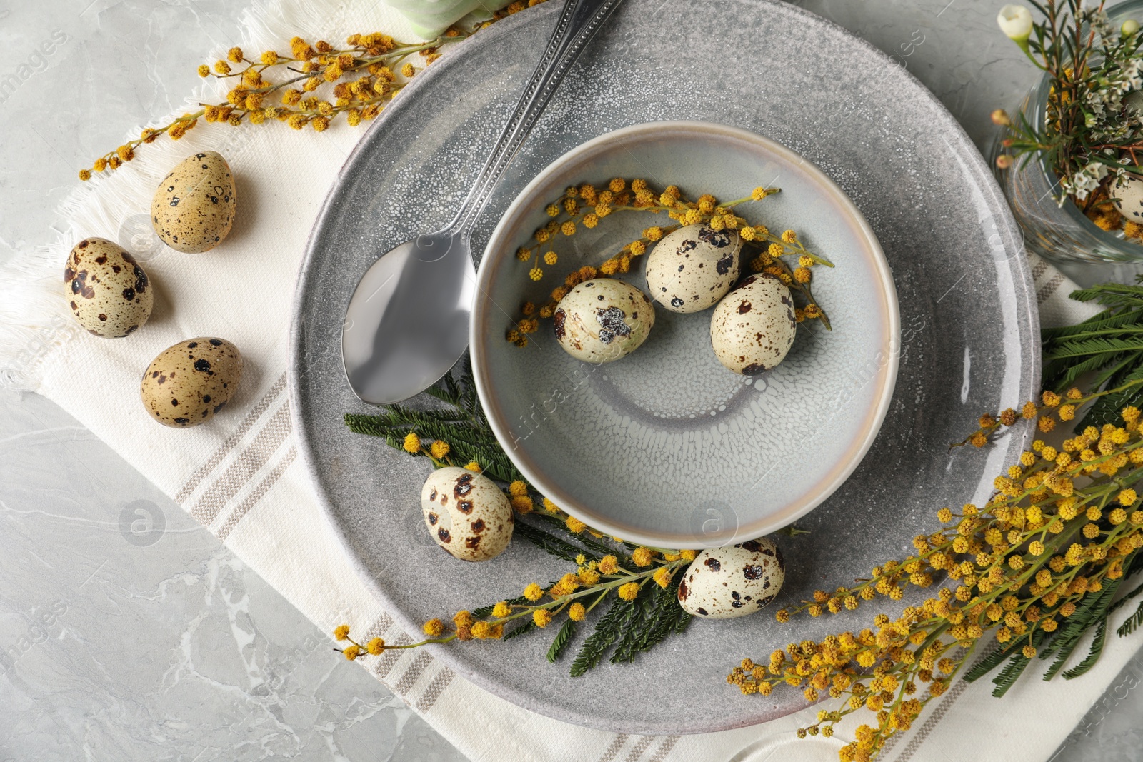 Photo of Festive Easter table setting with beautiful mimosa flowers, flat lay