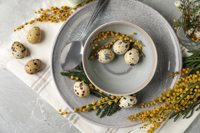 Festive Easter table setting with beautiful mimosa flowers, flat lay